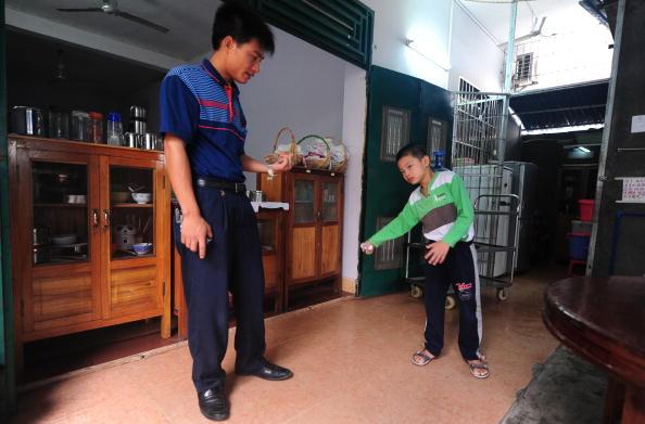 <a><img class="wp-image-1781722" src="https://www.theepochtimes.com/assets/uploads/2015/09/94465599.jpg" alt="Huang Zhuoxiang, who suffers from cerebral palsy" width="413" height="272"/></a>