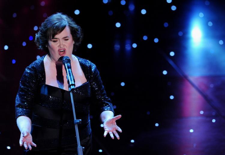 <a><img src="https://www.theepochtimes.com/assets/uploads/2015/09/96755851.jpg" alt="British singer Susan Boyle performs at the Ariston Theatre in Sanremo, during the 60th Italian Music Festival on February 16. (TIZIANA FABI/AFP/Getty Images)" title="British singer Susan Boyle performs at the Ariston Theatre in Sanremo, during the 60th Italian Music Festival on February 16. (TIZIANA FABI/AFP/Getty Images)" width="320" class="size-medium wp-image-1815697"/></a>