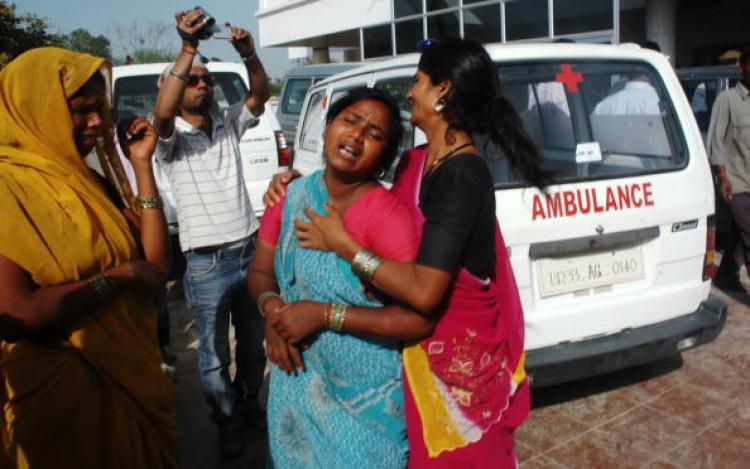 <a><img src="https://www.theepochtimes.com/assets/uploads/2015/09/97430878.jpg" alt="An Indian woman cries at a hospital after a stampede in Kunda,Uttar Pradesh.  Sixty-three people, all of them women and children, were crushed to death at a temple stampede.(STR/AFP/Getty Images)" title="An Indian woman cries at a hospital after a stampede in Kunda,Uttar Pradesh.  Sixty-three people, all of them women and children, were crushed to death at a temple stampede.(STR/AFP/Getty Images)" width="320" class="size-medium wp-image-1822437"/></a>