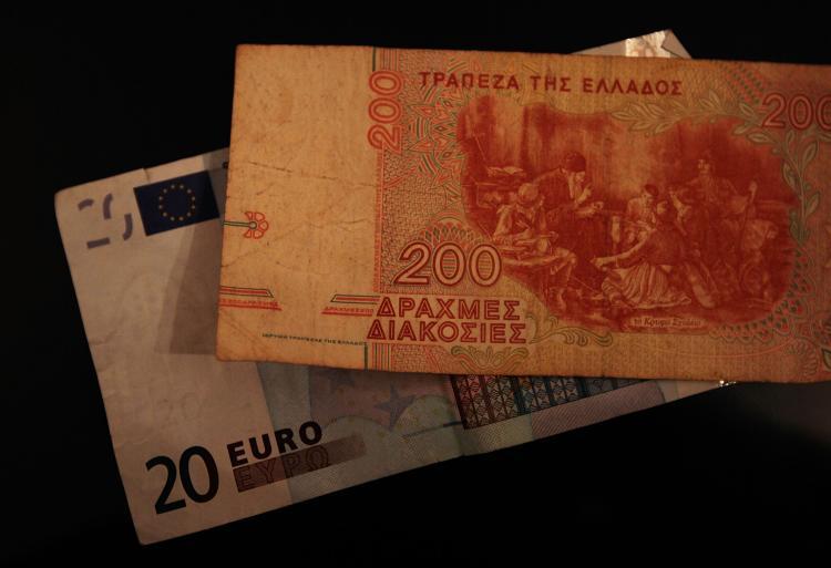 <a><img src="https://www.theepochtimes.com/assets/uploads/2015/09/98011529.jpg" alt="An old Greek drachma bill is seen on top of modern Euro. Greece continues to be the major source of woes for the European Union, as its debt crisis keeps spreading significant repercussions for the euro currency.  Last Friday, the euro hit its lowest poin (Chris Hondros/Getty Images)" title="An old Greek drachma bill is seen on top of modern Euro. Greece continues to be the major source of woes for the European Union, as its debt crisis keeps spreading significant repercussions for the euro currency.  Last Friday, the euro hit its lowest poin (Chris Hondros/Getty Images)" width="320" class="size-medium wp-image-1820130"/></a>