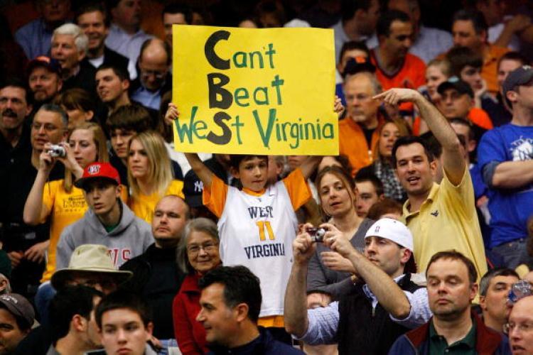 <a><img src="https://www.theepochtimes.com/assets/uploads/2015/09/98115011.jpg" alt="A fan of the WV Mountaineers holds up a sign in reference to the game being broadcast on CBS network against the Kentucky Wildcats.  (Chris Chambers/Getty Images)" title="A fan of the WV Mountaineers holds up a sign in reference to the game being broadcast on CBS network against the Kentucky Wildcats.  (Chris Chambers/Getty Images)" width="320" class="size-medium wp-image-1820072"/></a>