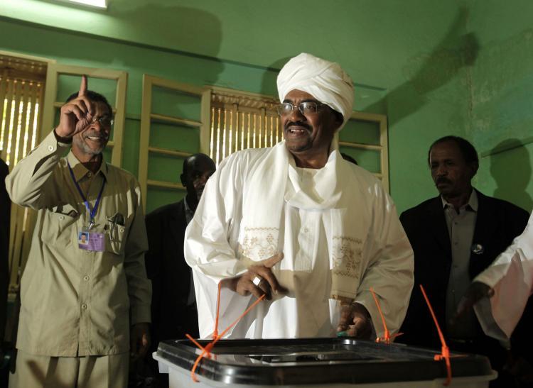 <a><img src="https://www.theepochtimes.com/assets/uploads/2015/09/98387273+SUDAN.jpg" alt="Sudanese President Omar al-Beshirs (C) entourage at the St. Francis Christian school polling station in Khartoum on April 11. (Patrick Baz/AFP/Getty Images)" title="Sudanese President Omar al-Beshirs (C) entourage at the St. Francis Christian school polling station in Khartoum on April 11. (Patrick Baz/AFP/Getty Images)" width="320" class="size-medium wp-image-1821189"/></a>