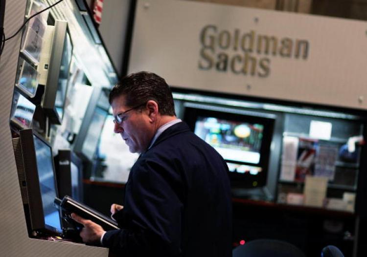 <a><img src="https://www.theepochtimes.com/assets/uploads/2015/09/98501963.jpg" alt="A financial professional works in the Goldman Sachs booth on the floor of the New York Stock Exchange April 16, 2010 in New York City. (Chris Hondros/Getty Images)" title="A financial professional works in the Goldman Sachs booth on the floor of the New York Stock Exchange April 16, 2010 in New York City. (Chris Hondros/Getty Images)" width="320" class="size-medium wp-image-1820685"/></a>