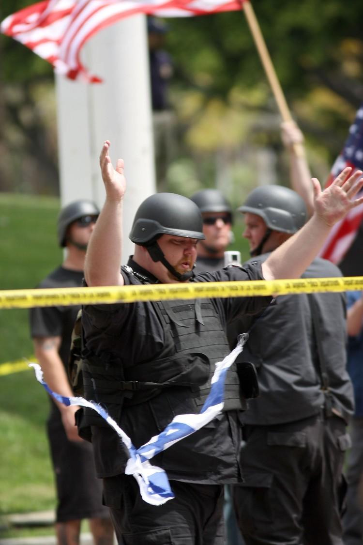 <a><img src="https://www.theepochtimes.com/assets/uploads/2015/09/98519412.jpg" alt="A member of the neo-Nazi group National Socialist Movement raises his arms after ripping up a flag of Israel during a rally on April 17, 2010, in Los Angeles. Hate crimes in Canada rose significantly in 2009, according to a Statistics Canada report. (David McNew/Getty Images)" title="A member of the neo-Nazi group National Socialist Movement raises his arms after ripping up a flag of Israel during a rally on April 17, 2010, in Los Angeles. Hate crimes in Canada rose significantly in 2009, according to a Statistics Canada report. (David McNew/Getty Images)" width="320" class="size-medium wp-image-1802735"/></a>
