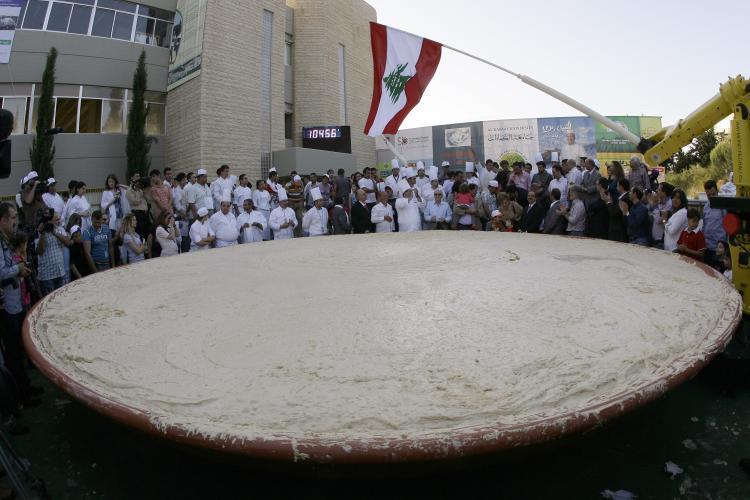 <a><img src="https://www.theepochtimes.com/assets/uploads/2015/09/98932298_10.jpg" alt="Hummus World Record: Lebanese chefs celebrate around the largest plate of hummus after setting a new Guinness world record in Beirut on May 8. The massive hummus serving weighed in at 10,452 kilograms (23,520 pounds), the size of Lebanon in square kilometers. (Anwar Amro/Getty Images)" title="Hummus World Record: Lebanese chefs celebrate around the largest plate of hummus after setting a new Guinness world record in Beirut on May 8. The massive hummus serving weighed in at 10,452 kilograms (23,520 pounds), the size of Lebanon in square kilometers. (Anwar Amro/Getty Images)" width="320" class="size-medium wp-image-1820084"/></a>