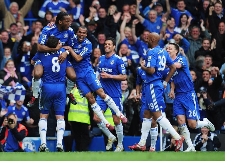 <a><img src="https://www.theepochtimes.com/assets/uploads/2015/09/98936754.jpg" alt="PREMIERSHIP CHAMPIONS: Didier Drogba of Chelsea celebrates with team mates as he scores their fifth goal (Shaun Botterill/Getty Images)" title="PREMIERSHIP CHAMPIONS: Didier Drogba of Chelsea celebrates with team mates as he scores their fifth goal (Shaun Botterill/Getty Images)" width="320" class="size-medium wp-image-1820134"/></a>