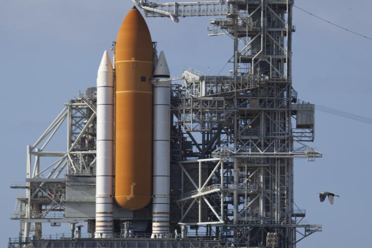 <a><img src="https://www.theepochtimes.com/assets/uploads/2015/09/9917086799170867." alt="Space Shuttle Atlantis sits behind the rotation service structure on May 13 in Cape Canaveral, Florida, as NASA workers make final preparations for Thursday's scheduled launch from the Kennedy Space Center to the International Space Station.  (Matt Stroshane/Getty Images)" title="Space Shuttle Atlantis sits behind the rotation service structure on May 13 in Cape Canaveral, Florida, as NASA workers make final preparations for Thursday's scheduled launch from the Kennedy Space Center to the International Space Station.  (Matt Stroshane/Getty Images)" width="300" class="size-medium wp-image-1819949"/></a>