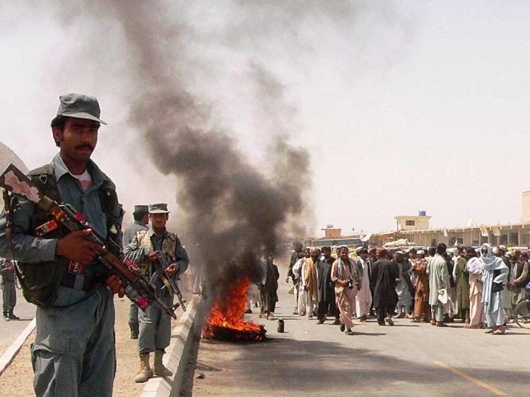 <a><img src="https://www.theepochtimes.com/assets/uploads/2015/09/AFGHAN98403568.jpg" alt="BACKLASH: Afghan police stand guard as protesters burn tires during a demonstration on the outskirts of Kandahar city on April 12. Four civilians were killed and 18 wounded on April 12 when NATO troops fired on a bus in Afghanistan, sparking a furious protest and shouts of 'death to America', officials and witnesses said. (AFP/Getty Images)" title="BACKLASH: Afghan police stand guard as protesters burn tires during a demonstration on the outskirts of Kandahar city on April 12. Four civilians were killed and 18 wounded on April 12 when NATO troops fired on a bus in Afghanistan, sparking a furious protest and shouts of 'death to America', officials and witnesses said. (AFP/Getty Images)" width="320" class="size-medium wp-image-1821159"/></a>