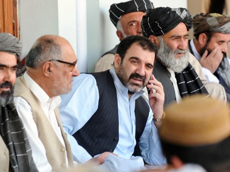 <a><img src="https://www.theepochtimes.com/assets/uploads/2015/09/AFGHANISTAN-92625485-COLOR.jpg" alt="ASSASSINATED: Ahmed Wali Karzai (C) is seen talking on the phone at a re-election celebration of his half-brother Afghan President Hamid Karzai on Nov. 3, 2009. Ahmed was shot and killed in an attack on Monday. (Banaras Khan/AFP/Getty Images)" title="ASSASSINATED: Ahmed Wali Karzai (C) is seen talking on the phone at a re-election celebration of his half-brother Afghan President Hamid Karzai on Nov. 3, 2009. Ahmed was shot and killed in an attack on Monday. (Banaras Khan/AFP/Getty Images)" width="320" class="size-medium wp-image-1800991"/></a>
