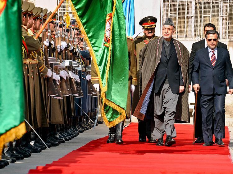 <a><img src="https://www.theepochtimes.com/assets/uploads/2015/09/AFGHANISTANC.jpg" alt="Afghan President Hamid Karzai (C) inspects a guard of honor during a ceremony in Kabul on Feb. 20. (Shah Marai/AFP/Getty Images)" title="Afghan President Hamid Karzai (C) inspects a guard of honor during a ceremony in Kabul on Feb. 20. (Shah Marai/AFP/Getty Images)" width="320" class="size-medium wp-image-1822708"/></a>