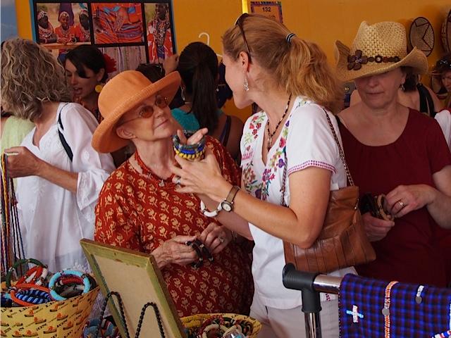 <a><img class="size-large wp-image-1782924" title="The Beads of Esiteti booth teams with shoppers who love the beads and support the cause at the July art market in Sante Fe. (Courtesy of ASK)" src="https://www.theepochtimes.com/assets/uploads/2015/09/ASK-booth-at-SFFAM.jpg" alt="The Beads of Esiteti booth teams with shoppers who love the beads and support the cause at the July art market in Sante Fe. (Courtesy of ASK)" width="590" height="442"/></a>