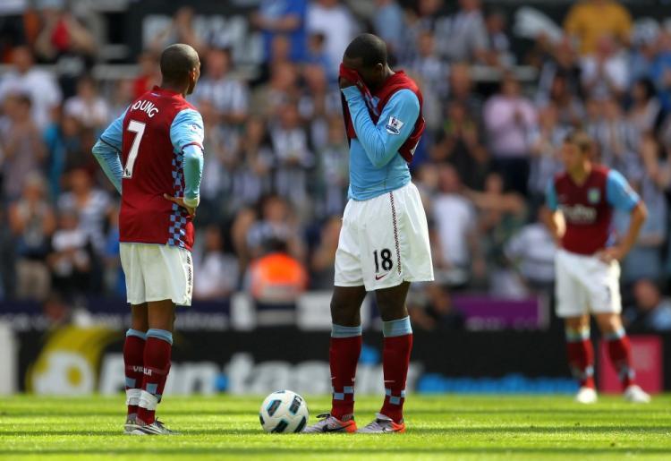 <a><img src="https://www.theepochtimes.com/assets/uploads/2015/09/AV103537687.jpg" alt="Aston Villa players stand dejected during their match against Newcastle last Sunday. (Alex Livesey/Getty Images )" title="Aston Villa players stand dejected during their match against Newcastle last Sunday. (Alex Livesey/Getty Images )" width="320" class="size-medium wp-image-1815679"/></a>