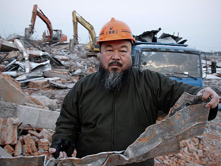 <a><img src="https://www.theepochtimes.com/assets/uploads/2015/09/Ai_Weiwei-108000513.jpg" alt="Chinese artist Ai Weiwei, 53, holds a piece of debris on January 11 after his newly built Shanghai studio was demolished. Ai is one of China's most famous, and defiant artists. He was arrested by authorities at Beijing Airport on Sunday and his whereabouts are unknown. (STR/AFP/Getty Images)" title="Chinese artist Ai Weiwei, 53, holds a piece of debris on January 11 after his newly built Shanghai studio was demolished. Ai is one of China's most famous, and defiant artists. He was arrested by authorities at Beijing Airport on Sunday and his whereabouts are unknown. (STR/AFP/Getty Images)" width="320" class="size-medium wp-image-1806124"/></a>