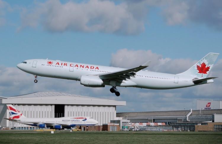 <a><img class="size-large wp-image-1768992" title="Aircanada.a330-300.c-ghkr.arp" src="https://www.theepochtimes.com/assets/uploads/2015/09/Aircanada.a330-300.c-ghkr.arp_.jpg" alt="" width="590" height="384"/></a>