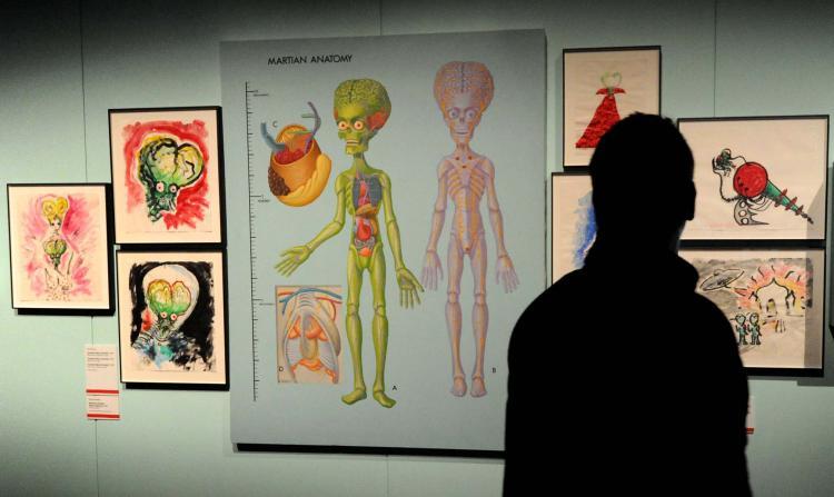 <a><img src="https://www.theepochtimes.com/assets/uploads/2015/09/Aliens_102319873a.jpg" alt="A Visitor looks at the Anatomy of a Martian at a major exhibition, presented as part of Melbourne Winter Masterpieces 2010, which explores the full career of artist and film maker Tim Burton, as a director, concept artist illustrator and photographer. (WILLIAM WEST/AFP/Getty Images)" title="A Visitor looks at the Anatomy of a Martian at a major exhibition, presented as part of Melbourne Winter Masterpieces 2010, which explores the full career of artist and film maker Tim Burton, as a director, concept artist illustrator and photographer. (WILLIAM WEST/AFP/Getty Images)" width="320" class="size-medium wp-image-1815880"/></a>