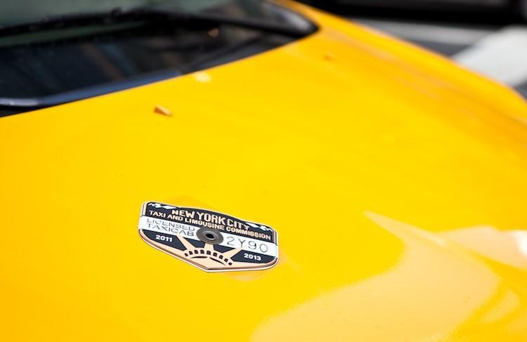 <a><img src="https://www.theepochtimes.com/assets/uploads/2015/09/AmalChen-20111020-IMG_9759.jpg" alt="A medallion on the hood of a yellow cab in New York City." title="A medallion on the hood of a yellow cab in New York City." width="575" class="size-medium wp-image-1796056"/></a>