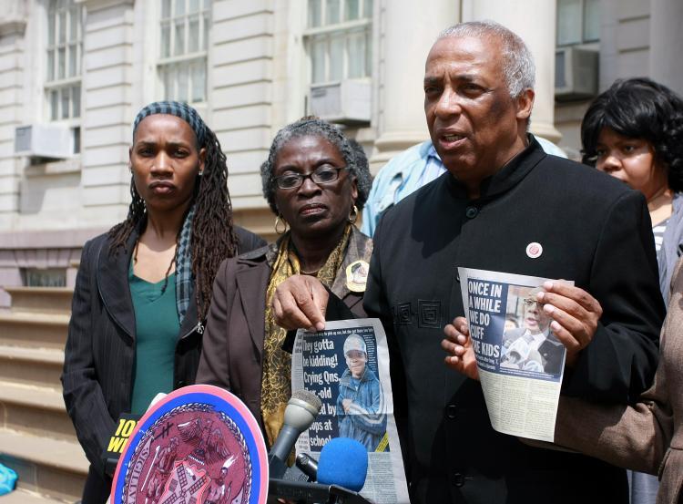 <a><img src="https://www.theepochtimes.com/assets/uploads/2015/09/Barron85cuffs.jpg" alt="BAD NEWS: Councilman Charles Barron (R) holds up two newspaper articles: one about a 7-year-old restrained with handcuffs in a Bronx public school, the other about Schools Chancellor Denis Walcott's position on handcuff use in schools. At his side is his wife, Assemblywoman Inez Barron (C), and his legislative director, Ndigo Washington (L). (Tara MacIsaac/The Epoch Times)" title="BAD NEWS: Councilman Charles Barron (R) holds up two newspaper articles: one about a 7-year-old restrained with handcuffs in a Bronx public school, the other about Schools Chancellor Denis Walcott's position on handcuff use in schools. At his side is his wife, Assemblywoman Inez Barron (C), and his legislative director, Ndigo Washington (L). (Tara MacIsaac/The Epoch Times)" width="320" class="size-medium wp-image-1804787"/></a>