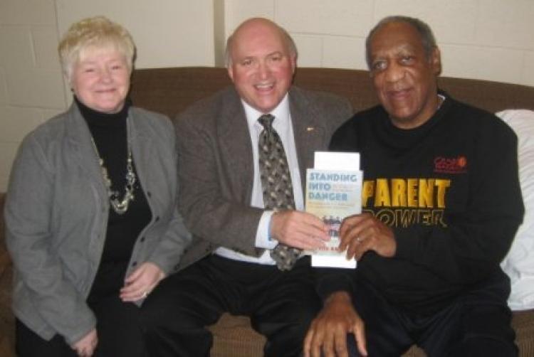 <a><img src="https://www.theepochtimes.com/assets/uploads/2015/09/BillCosby-Newfoundland.jpg" alt="Bill Cosby invited St. Lawrence Mayor Wayde Rowsell and his wife, Carmelita, to attend his show in St. John's, Newfoundland and Labrador (NL), on Dec. 4, 2009, and also to meet him backstage prior to the show. The men are holding 'Standing into Danger,' a book by Cassie Brown about the U.S. naval disaster off the coast of NL in WWII and the dramatic rescue by the people of the nearby towns of St. Lawrence and Lawn. (Courtesy of Wayde Rowsell)" title="Bill Cosby invited St. Lawrence Mayor Wayde Rowsell and his wife, Carmelita, to attend his show in St. John's, Newfoundland and Labrador (NL), on Dec. 4, 2009, and also to meet him backstage prior to the show. The men are holding 'Standing into Danger,' a book by Cassie Brown about the U.S. naval disaster off the coast of NL in WWII and the dramatic rescue by the people of the nearby towns of St. Lawrence and Lawn. (Courtesy of Wayde Rowsell)" width="320" class="size-medium wp-image-1824877"/></a>