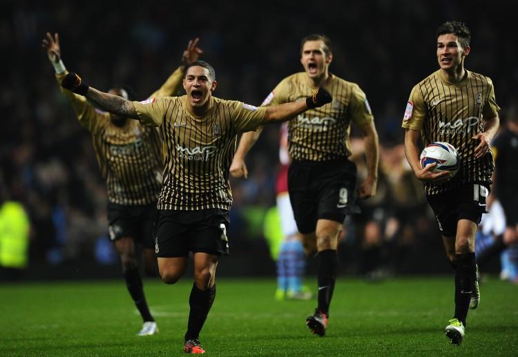 <a><img class="size-full wp-image-1771723" title="Aston Villa v Bradford City - Capital One Cup Semi-Final Second Leg" src="https://www.theepochtimes.com/assets/uploads/2015/09/Bradford159888711.jpg" alt="Bradford City's Nathan Doyle and his teammates celebrate after reaching the final of the Capital One Cup at Villa Park in Birmingham, England on Tuesday, Jan. 22, 2012. (Laurence Griffiths/Getty Images) " width="750" height="517"/></a>