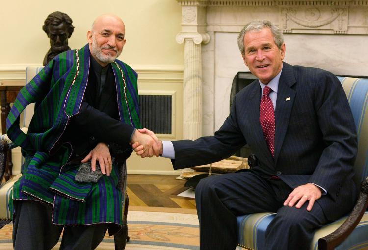 <a><img src="https://www.theepochtimes.com/assets/uploads/2015/09/BushAndKarzaiAtWH.jpg" alt="OVAL OFFICE: President George W. Bush (R) shakes hands with Afghan President Hamid Karzai (L) during their meeting in the Oval Office of the White House Sept. 26 in Washington, DC. (Alex Wong/Getty Images)" title="OVAL OFFICE: President George W. Bush (R) shakes hands with Afghan President Hamid Karzai (L) during their meeting in the Oval Office of the White House Sept. 26 in Washington, DC. (Alex Wong/Getty Images)" width="320" class="size-medium wp-image-1833590"/></a>
