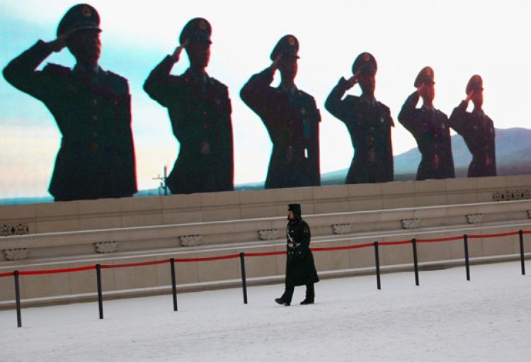 <a><img src="https://www.theepochtimes.com/assets/uploads/2015/09/CHINA-MILITARY-108961285.jpg" alt="STRONG AMBITIONS: A Chinese paramilitary policeman guards in front of a LED screen at Tiananmen Square in the snow on Feb. 10, in Beijing, China.   (Feng Li/Getty Images)" title="STRONG AMBITIONS: A Chinese paramilitary policeman guards in front of a LED screen at Tiananmen Square in the snow on Feb. 10, in Beijing, China.   (Feng Li/Getty Images)" width="320" class="size-medium wp-image-1808142"/></a>