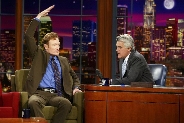 <a><img src="https://www.theepochtimes.com/assets/uploads/2015/09/CONANO.jpg" alt="Conan O'Brien (L) appears on 'The Tonight Show with Jay Leno' in 2003. O'Brien succeeded Leno as host for a short-lived 7 months before NBC made costly moves to reinstate Leno. Tonight is O'Brien's last night as host." title="Conan O'Brien (L) appears on 'The Tonight Show with Jay Leno' in 2003. O'Brien succeeded Leno as host for a short-lived 7 months before NBC made costly moves to reinstate Leno. Tonight is O'Brien's last night as host." width="320" class="size-medium wp-image-1823714"/></a>