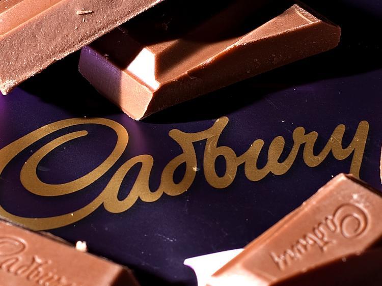 <a><img src="https://www.theepochtimes.com/assets/uploads/2015/09/Cad95768200WEB.jpg" alt="Cadbury's share price is rising as rumors of a bigger offer from Kraft arise. (Leon Neal/AFP/Getty Images )" title="Cadbury's share price is rising as rumors of a bigger offer from Kraft arise. (Leon Neal/AFP/Getty Images )" width="320" class="size-medium wp-image-1823904"/></a>