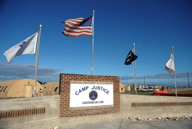 <a><img src="https://www.theepochtimes.com/assets/uploads/2015/09/CampJustice-Getty83949836.jpg" alt="CAMP JUSTICE: An image reviewed by the US military shows a 'Camp Justice' sign near the high-tech, high-security courtroom which will hold the pre-trial sessions for Khalid Sheikh Mohammed and his four co-defendants on charges related to the 9/11 attacks  (Mandel Ngan-Pool/Getty Images)" title="CAMP JUSTICE: An image reviewed by the US military shows a 'Camp Justice' sign near the high-tech, high-security courtroom which will hold the pre-trial sessions for Khalid Sheikh Mohammed and his four co-defendants on charges related to the 9/11 attacks  (Mandel Ngan-Pool/Getty Images)" width="320" class="size-medium wp-image-1832203"/></a>