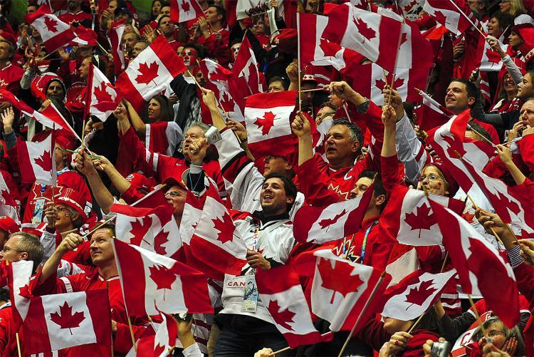 <a><img src="https://www.theepochtimes.com/assets/uploads/2015/09/Canflags96936865.jpg" alt="Canadian fans wave flags before the Men's preliminary Ice Hockey match Canada against USA at the XXI Winter Olympic games in Vancouver. At no other time or place would one see such overt patriotism from Canadians. (Luis Acosta/AFP/Getty Images)" title="Canadian fans wave flags before the Men's preliminary Ice Hockey match Canada against USA at the XXI Winter Olympic games in Vancouver. At no other time or place would one see such overt patriotism from Canadians. (Luis Acosta/AFP/Getty Images)" width="320" class="size-medium wp-image-1812743"/></a>