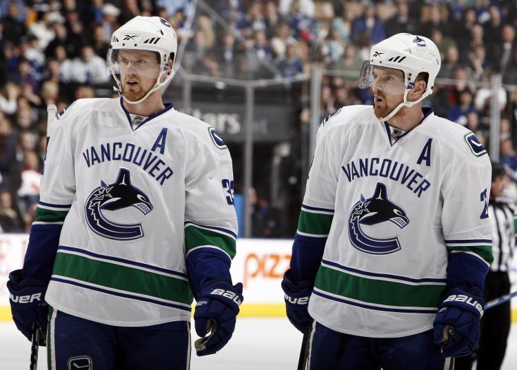 <a><img src="https://www.theepochtimes.com/assets/uploads/2015/09/Canucks96335697.jpg" alt="ROAD WARRIORS: Daniel and Henrik Sedin and the Vancouver Canucks embark on a 14-game road trip due to the Olympics. The twins will represent Sweden in the Olympic men's ice hockey tournament. (Abelimages/Getty Images)" title="ROAD WARRIORS: Daniel and Henrik Sedin and the Vancouver Canucks embark on a 14-game road trip due to the Olympics. The twins will represent Sweden in the Olympic men's ice hockey tournament. (Abelimages/Getty Images)" width="320" class="size-medium wp-image-1823461"/></a>