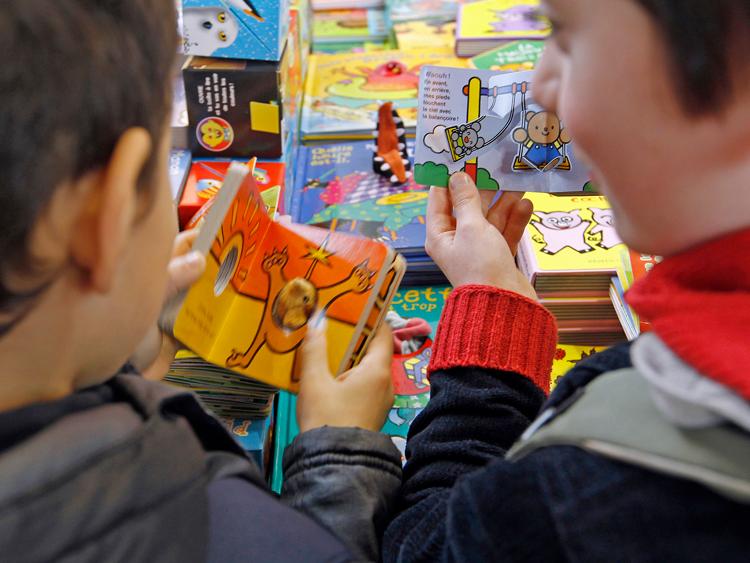 <a><img class="size-full wp-image-1791445" title="Two boys at book fair" src="https://www.theepochtimes.com/assets/uploads/2015/09/ChildrenReading110467610.jpg" alt="" width="750" height="563"/></a>