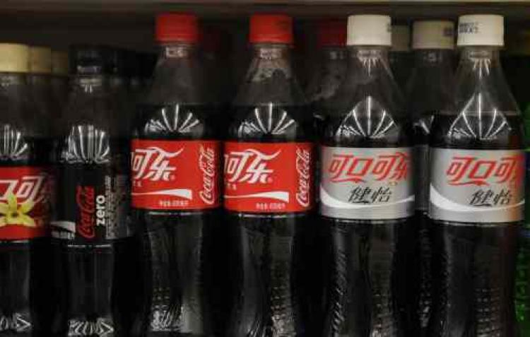 <a><img src="https://www.theepochtimes.com/assets/uploads/2015/09/Coke.jpg" alt="Bottles of Coca-Cola sit on the shelves of a grocery store in Beijing, China. Asian sales propelled Coca-Cola's bottom line during second quarter 2009. (Peter Parks/AFP/Getty Images)" title="Bottles of Coca-Cola sit on the shelves of a grocery store in Beijing, China. Asian sales propelled Coca-Cola's bottom line during second quarter 2009. (Peter Parks/AFP/Getty Images)" width="320" class="size-medium wp-image-1827236"/></a>
