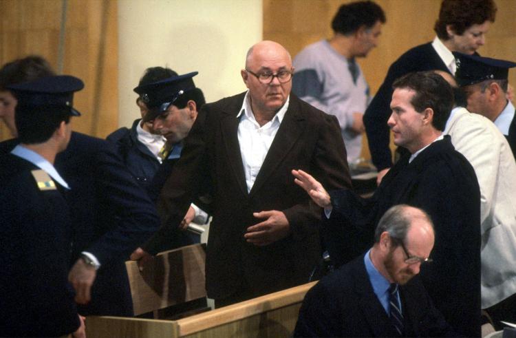 <a><img src="https://www.theepochtimes.com/assets/uploads/2015/09/Demjanjuk.jpg" alt="John Demjanjuk (C) speaks to his attorney Mark O'Connor in a courtroom at the start of his trial Feb. 16, 1987, in a Jerusalem, Israel.  (Yaakov Sa''ar/GPO/Getty Images)" title="John Demjanjuk (C) speaks to his attorney Mark O'Connor in a courtroom at the start of his trial Feb. 16, 1987, in a Jerusalem, Israel.  (Yaakov Sa''ar/GPO/Getty Images)" width="320" class="size-medium wp-image-1825009"/></a>