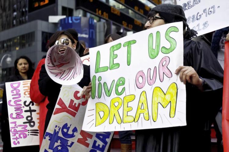 <a><img src="https://www.theepochtimes.com/assets/uploads/2015/09/DreamAct-9861.jpg" alt="EDUCATION NOT DEPORTATION: Undocumented immigrant youths show support for the DREAM Act on Monday at a rally in Times Square. (Phoebe Zheng/The Epoch Times)" title="EDUCATION NOT DEPORTATION: Undocumented immigrant youths show support for the DREAM Act on Monday at a rally in Times Square. (Phoebe Zheng/The Epoch Times)" width="320" class="size-medium wp-image-1811497"/></a>