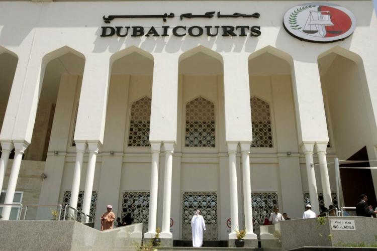 <a><img src="https://www.theepochtimes.com/assets/uploads/2015/09/Dubai+April+5.jpg" alt="The Dubai Courts building during a hearing on April 04, 2010, in the case of a British couple sentenced to a month in jail after being convicted of kissing in public in a restaurant in the Muslim Gulf emirate. (Thomas Coex/AFP/Getty Images)" title="The Dubai Courts building during a hearing on April 04, 2010, in the case of a British couple sentenced to a month in jail after being convicted of kissing in public in a restaurant in the Muslim Gulf emirate. (Thomas Coex/AFP/Getty Images)" width="320" class="size-medium wp-image-1821394"/></a>