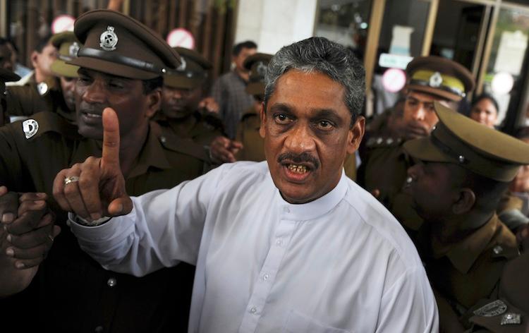 <a><img class="size-large wp-image-1787294" title="Sri Lanka's jailed ex-army chief and opposition leader Sarath Fonseka gestures as he arrives at the Court of Colombo,  January 25, 2012. (Ishara S. Kodikara/AFP/GettyImages)" src="https://www.theepochtimes.com/assets/uploads/2015/09/Fonseka144708524.jpg" alt="" width="590" height="371"/></a>
