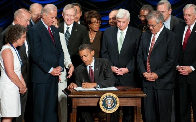 <a><img src="https://www.theepochtimes.com/assets/uploads/2015/09/FrankActSigned.jpg" alt="President Barack Obama signs the Dodd-Frank Wall Street Reform and Consumer Protection Act alongside members of Congress, the administration and U.S. Vice President Joe Biden at the Ronald Reagan Building in Washington, D.C., July 21, 2010. (Photo ROD LAMKEY JR/AFP/Getty Images)" title="President Barack Obama signs the Dodd-Frank Wall Street Reform and Consumer Protection Act alongside members of Congress, the administration and U.S. Vice President Joe Biden at the Ronald Reagan Building in Washington, D.C., July 21, 2010. (Photo ROD LAMKEY JR/AFP/Getty Images)" width="320" class="size-medium wp-image-1802300"/></a>