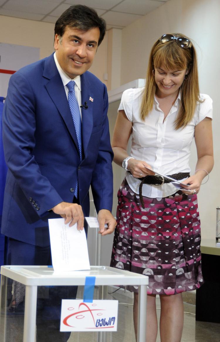 <a><img src="https://www.theepochtimes.com/assets/uploads/2015/09/GEO101280274.jpg" alt="Georgian President Mikheil Saakashvili and his wife Sandra Roelofs vote in Tbilisi on May 30. Georgians voted in nationwide municipal elections seen as a key test of pro-Western President Mikheil Saakashvili's commitment to democratic reform. (Irakli Gedenidze/Getty Images)" title="Georgian President Mikheil Saakashvili and his wife Sandra Roelofs vote in Tbilisi on May 30. Georgians voted in nationwide municipal elections seen as a key test of pro-Western President Mikheil Saakashvili's commitment to democratic reform. (Irakli Gedenidze/Getty Images)" width="320" class="size-medium wp-image-1819257"/></a>