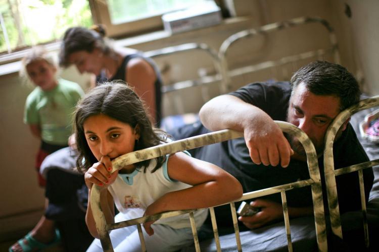 <a><img src="https://www.theepochtimes.com/assets/uploads/2015/09/GEORGIA-8239208.jpg" alt="Displaced Georgians from the breakaway province of South Ossetia sit on a bed in a refugee shelter in Tbilisi, Georgia on Aug. 17, 2008.  (Uriel Sinai/Getty Images)" title="Displaced Georgians from the breakaway province of South Ossetia sit on a bed in a refugee shelter in Tbilisi, Georgia on Aug. 17, 2008.  (Uriel Sinai/Getty Images)" width="320" class="size-medium wp-image-1816405"/></a>