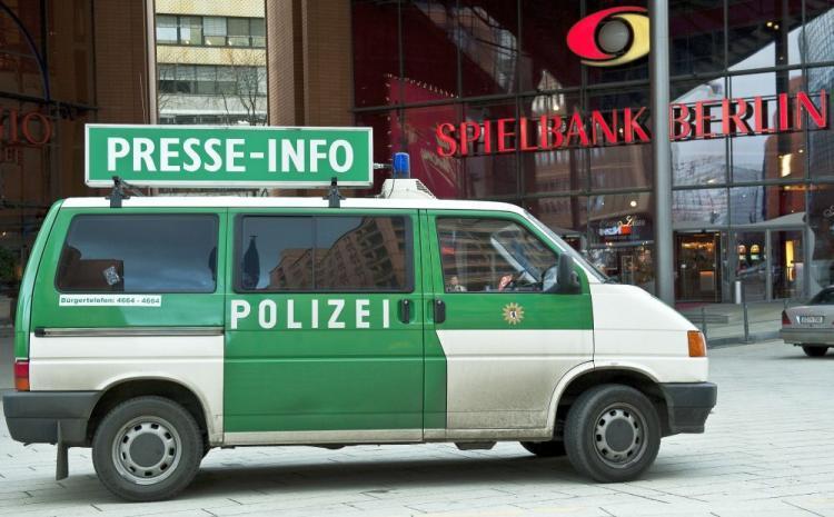 <a><img src="https://www.theepochtimes.com/assets/uploads/2015/09/GERMANY.jpg" alt="A Police press information vehicle is parked in front of the 'Spielbank' casino at Potsdamer Plarz in Berlin on March 6. Armed robbers raided a poker competition taking place across the road in the Grand Hyatt Hotel and made off with Over $136,000.  (Timur Emek/AFP/Getty Images)" title="A Police press information vehicle is parked in front of the 'Spielbank' casino at Potsdamer Plarz in Berlin on March 6. Armed robbers raided a poker competition taking place across the road in the Grand Hyatt Hotel and made off with Over $136,000.  (Timur Emek/AFP/Getty Images)" width="320" class="size-medium wp-image-1822356"/></a>