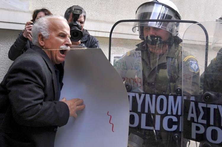 <a><img src="https://www.theepochtimes.com/assets/uploads/2015/09/GREECE-97391194.jpg" alt="A pensioner tries to pass through a riot police cordon blocking the way to the prime minister's office in Athens on March 3, during a demonstration to protest against the government's austerity measures. (Louisa Gouliamaki/AFP/Getty Images)" title="A pensioner tries to pass through a riot police cordon blocking the way to the prime minister's office in Athens on March 3, during a demonstration to protest against the government's austerity measures. (Louisa Gouliamaki/AFP/Getty Images)" width="320" class="size-medium wp-image-1822454"/></a>