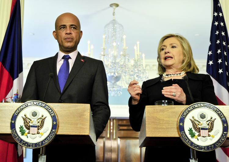 <a><img src="https://www.theepochtimes.com/assets/uploads/2015/09/HAITI-PHOTO1-COLOR.jpg" alt="Haiti's new president-elect Michel Martelly giving a joint press conference with Secretary of State Hillary Clinton on April 19. (Jewel Samad/Getty Images)" title="Haiti's new president-elect Michel Martelly giving a joint press conference with Secretary of State Hillary Clinton on April 19. (Jewel Samad/Getty Images)" width="320" class="size-medium wp-image-1805231"/></a>