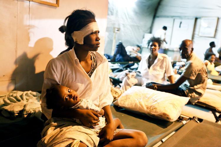 <a><img src="https://www.theepochtimes.com/assets/uploads/2015/09/HAITI2-COLOUR.jpg" alt="AFTERMATH: A injured woman and her baby are seen at a makeshift field hospital on Jan. 13 in Port-au-Prince, Haiti. (Joe Raedle/Getty Images)" title="AFTERMATH: A injured woman and her baby are seen at a makeshift field hospital on Jan. 13 in Port-au-Prince, Haiti. (Joe Raedle/Getty Images)" width="320" class="size-medium wp-image-1824015"/></a>