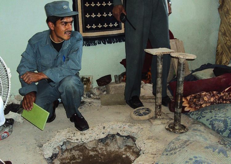<a><img src="https://www.theepochtimes.com/assets/uploads/2015/09/HOLE-113152450.jpg" alt="BAD BREAK: An Afghan policeman sits next to the entrance of the tunnel in room number 7 of the Political Prisoners section through which Taliban fighters escaped in an audacious jailbreak in Kandahar city on April 25. The government admitted it was a security disaster in the prison, the second largest break in three years. (STR/Getty Images)" title="BAD BREAK: An Afghan policeman sits next to the entrance of the tunnel in room number 7 of the Political Prisoners section through which Taliban fighters escaped in an audacious jailbreak in Kandahar city on April 25. The government admitted it was a security disaster in the prison, the second largest break in three years. (STR/Getty Images)" width="320" class="size-medium wp-image-1804890"/></a>