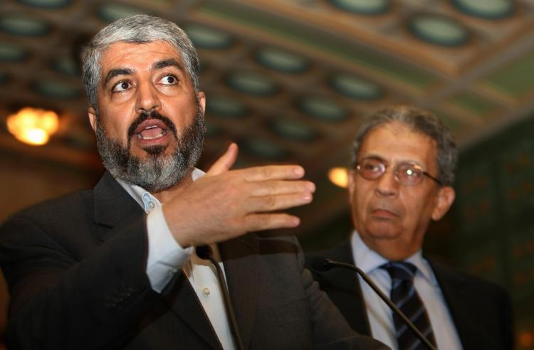 <a><img src="https://www.theepochtimes.com/assets/uploads/2015/09/Hamas.jpg" alt="Exiled Palestinian Hamas leader Khaled Mashaal (L) speaks during a joint press conference in a file photo in Cairo on June 9, 2009. (Cris Bouroncle/AFP/Getty Images)" title="Exiled Palestinian Hamas leader Khaled Mashaal (L) speaks during a joint press conference in a file photo in Cairo on June 9, 2009. (Cris Bouroncle/AFP/Getty Images)" width="320" class="size-medium wp-image-1826751"/></a>