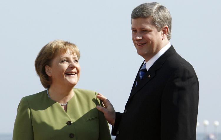 <a><img src="https://www.theepochtimes.com/assets/uploads/2015/09/Harper_74429777.jpg" alt="German Chancellor Angela Merkel and Canadian Prime Minister Stephen Harper both stayed away from the Olympic opening ceremony. (Michael Kappeler/AFP/Getty Images)" title="German Chancellor Angela Merkel and Canadian Prime Minister Stephen Harper both stayed away from the Olympic opening ceremony. (Michael Kappeler/AFP/Getty Images)" width="320" class="size-medium wp-image-1834418"/></a>
