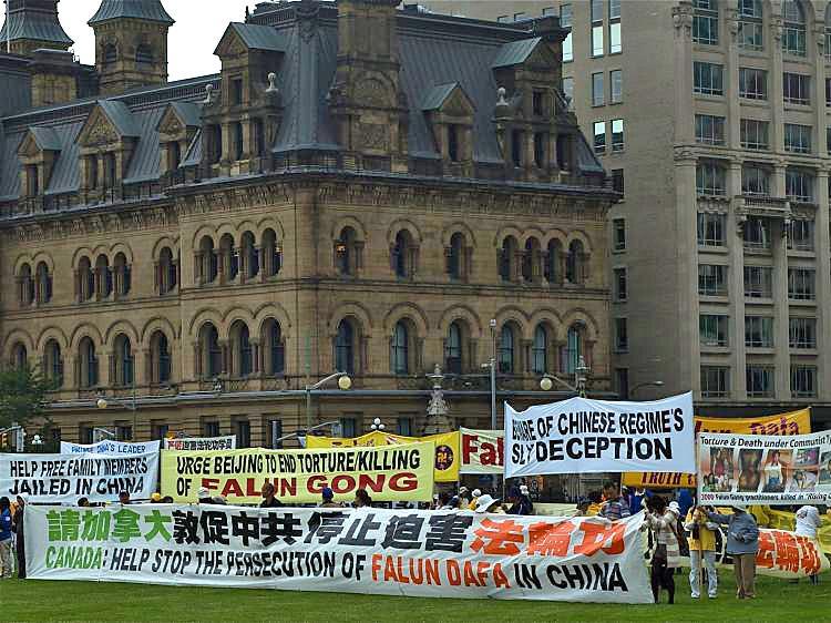Falun Gong practitioners rally on Parliament Hill on June 16, 2010 ahead of Hu Jintao's visit to Canada . A tape recording reveals a Chinese embassy official telling Chinese students they must join Hu Jintao's welcome rally to counteract rallies held by human rights advocates. (Matthew Little/The Epoch Times)