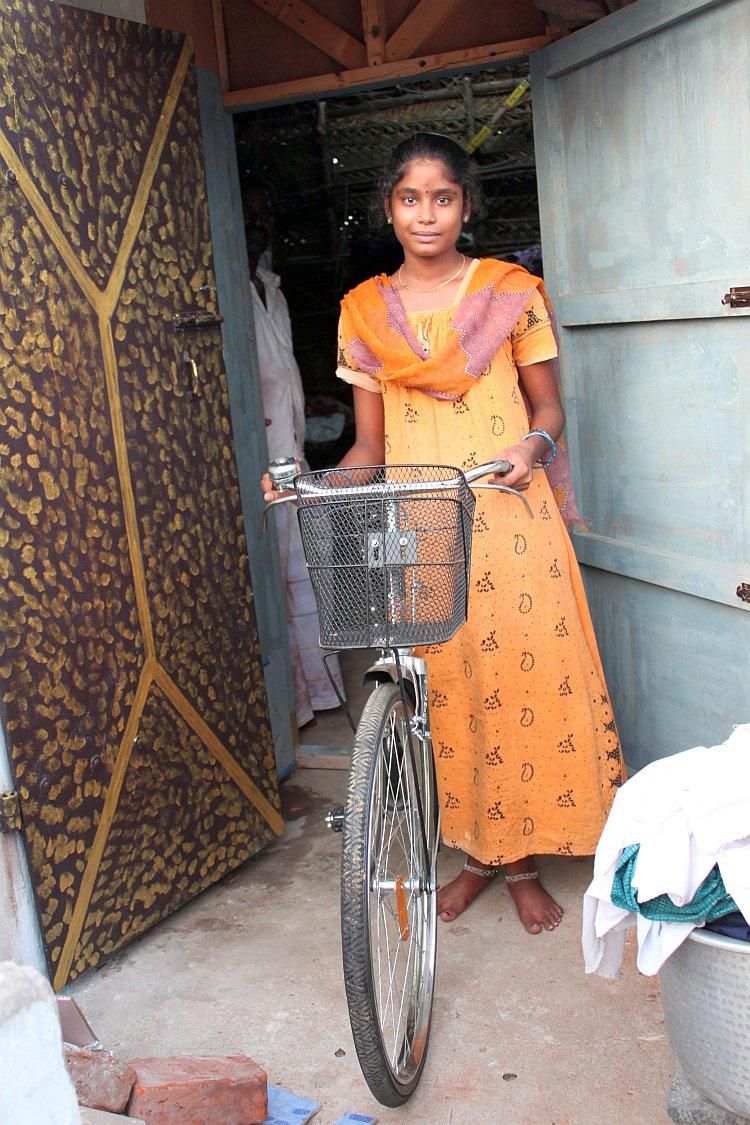<a><img class="wp-image-1783041" title="Aishwariya with her new bike in the attic of her home after the school hours. She is one of 86 boys and girls who passed secondary school exams to get a bike under a new program launched in Puducherry, India this year. (Venus Upadhayaya/The Epoch Times)." src="https://www.theepochtimes.com/assets/uploads/2015/09/IMG_6527.jpg" alt="Aishwariya with her new bike in the attic of her home after the school hours. She is one of 86 boys and girls who passed secondary school exams to get a bike under a new program launched in Puducherry, India this year. (Venus Upadhayaya/The Epoch Times)." width="275" height="413"/></a>