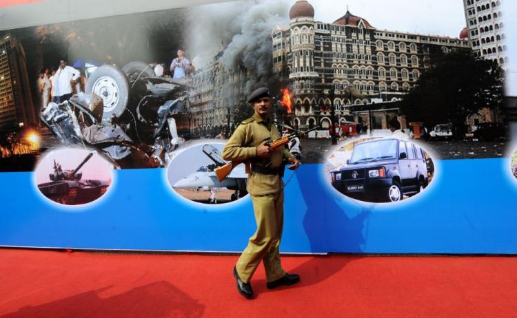 <a><img src="https://www.theepochtimes.com/assets/uploads/2015/09/INDIA-96777601.jpg" alt="An Indian paramilitary soldier walks past a mural depicting the Mumbai 2008 terror attacks at the DefExpo 2010 in New Delhi on February 17. An American pleaded guilty in India of involvement in the attacks.  (Raveendran/AFP/Getty Images)" title="An Indian paramilitary soldier walks past a mural depicting the Mumbai 2008 terror attacks at the DefExpo 2010 in New Delhi on February 17. An American pleaded guilty in India of involvement in the attacks.  (Raveendran/AFP/Getty Images)" width="320" class="size-medium wp-image-1821911"/></a>