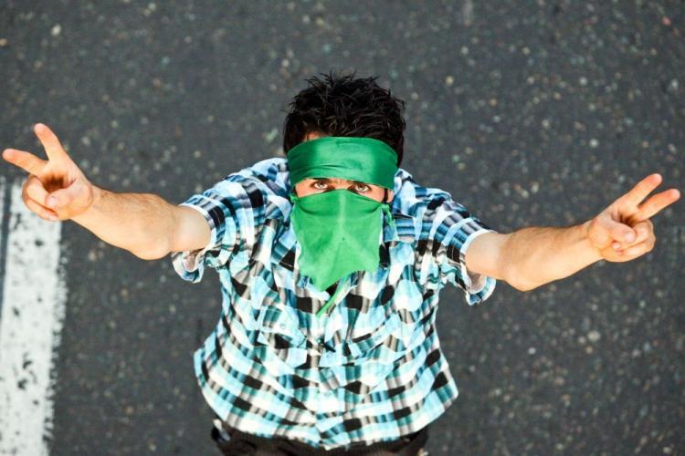 <a><img src="https://www.theepochtimes.com/assets/uploads/2015/09/IRANPROTESTOR-C.jpg" alt="An Iranian man protesting the disputed elections results in June last year. (AFP/Getty Images)" title="An Iranian man protesting the disputed elections results in June last year. (AFP/Getty Images)" width="320" class="size-medium wp-image-1823586"/></a>